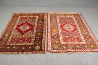 A pair of North West Persian style rugs. L.168 W.100cm. (each).