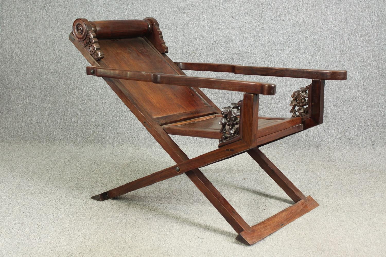 A Chinese carved hardwood folding chair, 19th century. H.78 W.112 D.59cm. - Image 3 of 12