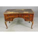 A George II style mahogany writing desk, with a worn leather top. H.76 W.123 D.66cm.