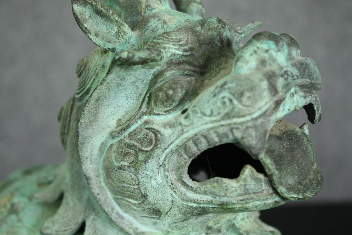 A pair of Chinese Tang style bronzed metal temple lions, with verdigris patination. H.33cm. (each). - Image 7 of 7