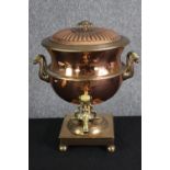 A 19th century copper samovar. H.38 W.32 D.35cm.