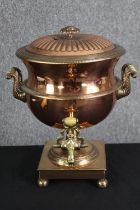 A 19th century copper samovar. H.38 W.32 D.35cm.