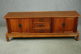 A contemporary Chinese cherrywood sideboard. H.60 W.160 D.37cm.