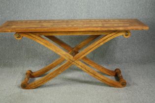 An American console table by Maitland-Smith, with a satin birch parquetry inlaid and crossbanded