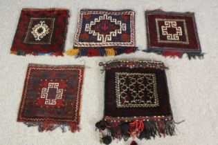 a group of five Tekke style cushion covers, 20th Century. L.45 W.40cm. (largest).