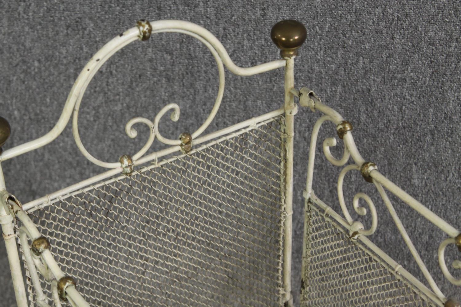 A white painted metal and brass cot, early 20th century. H.64 W.69 D.38cm. - Image 6 of 9