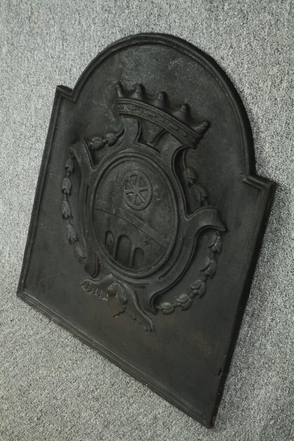 A cast iron fireback, possibly late 18th century. H.67 W.54cm. - Image 3 of 4