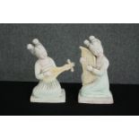 Two Chinese Tang Dynasty style white painted terracotta female musicians. H.27cm. (each).