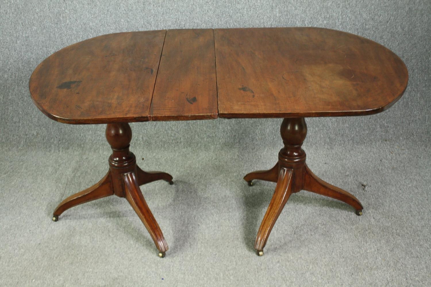 A late Georgian pedestal 'D' end mahogany dining table, with drop flap central leaf. H.73 W.144(ext) - Image 2 of 5