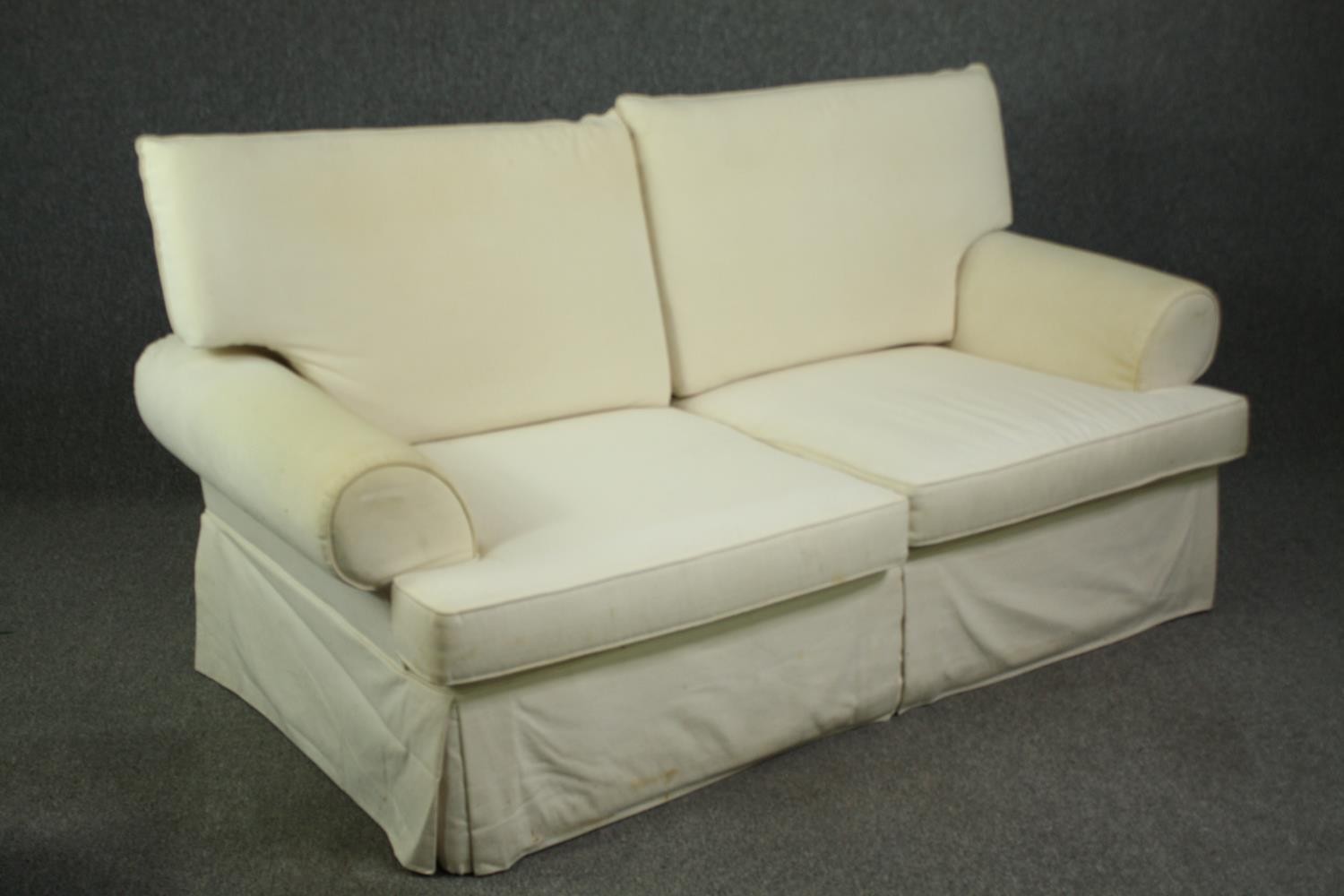 A two seater sofa in ivory upholstery. H.96 W.183 D.95cm. - Image 2 of 5
