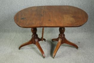 A late Georgian pedestal 'D' end mahogany dining table, with drop flap central leaf. H.73 W.144(ext)
