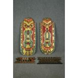 A pair of Indonesian painted head masks, with other smaller associated carvings. L.103 W.42cm. (