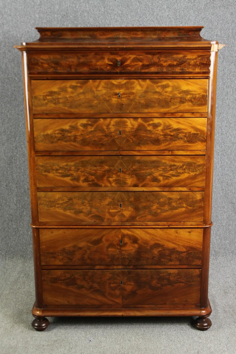 A French two sectioned walnut semanier, circa 1860. H.160 W.102 D.51cm.