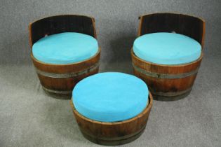 A pair of tub chairs, converted from coopered hardwood and metal mounted barrels with electric