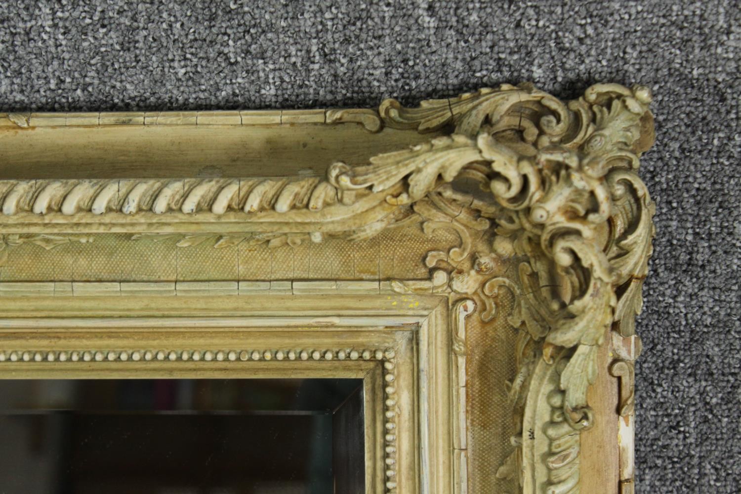 A cream painted carved wood and gesso wall mirror. H.96 W.77cm. - Image 4 of 5