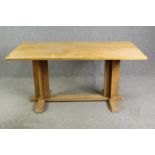 In the manner of Heals, a light oak Arts and Crafts refectory table H.75 W.158 D.86cm.