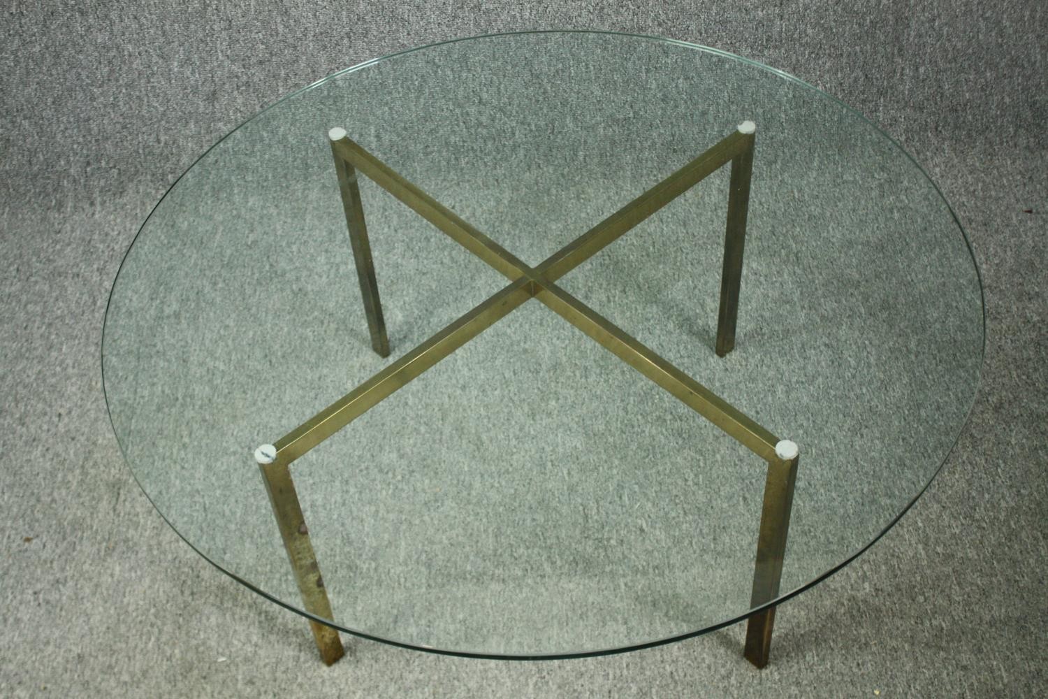 A vintage glass coffee table on brass supports. H.39 Dia.91cm. - Image 3 of 5