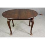 An extending mahogany dining table in George II style, early 20th Century, extra leaf with wind