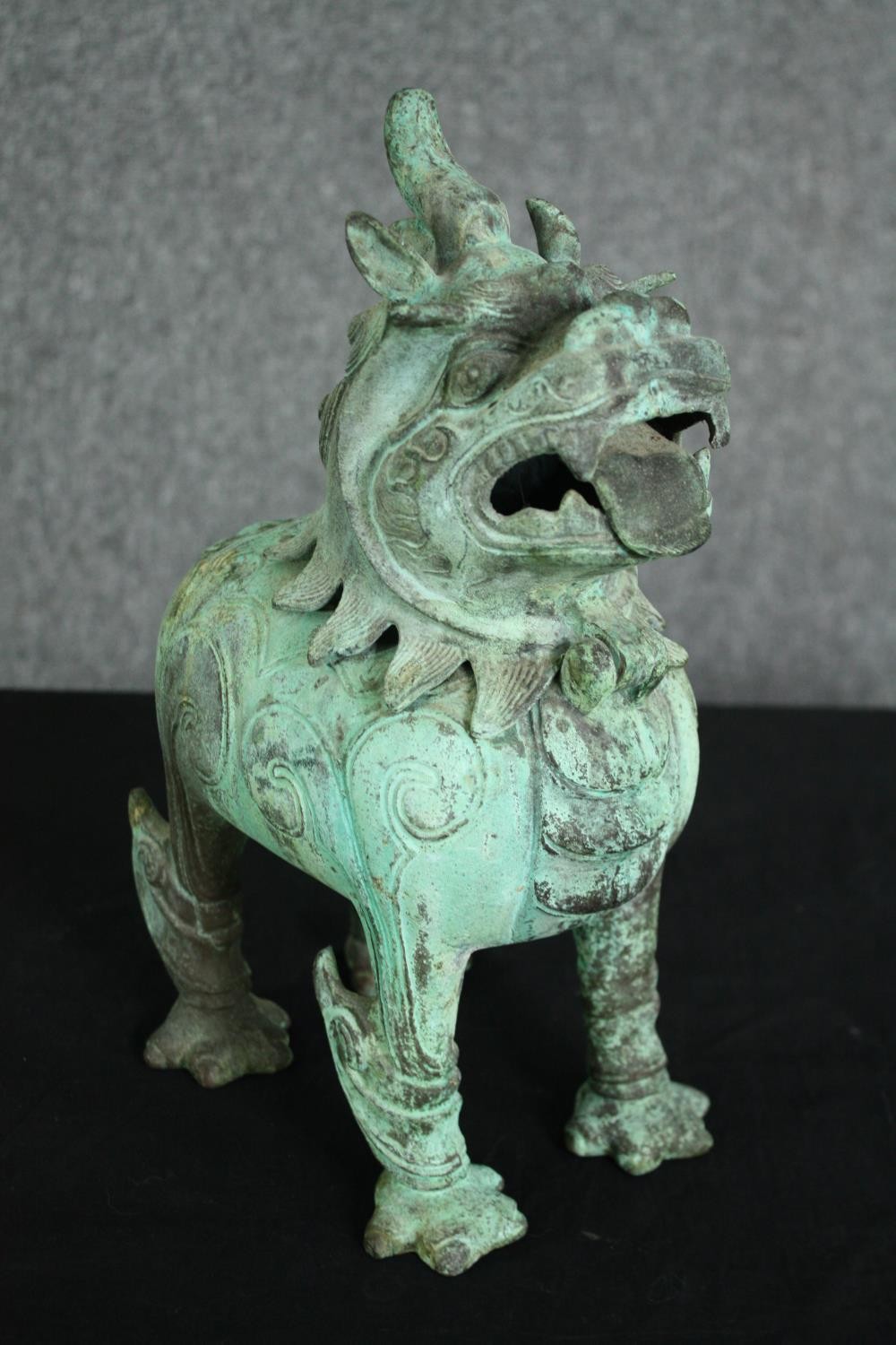 A pair of Chinese Tang style bronzed metal temple lions, with verdigris patination. H.33cm. (each). - Image 5 of 7