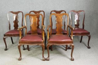 A set of six walnut dining chairs, in the George II style, including two carvers. H.126 W.100 D.