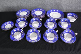 A Hawkins, mid 20th century porcelain part tea service. Dia.23cm. (largest).