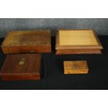 A group of four boxes, in various woods. H.7 W.35 D.27cm. (largest).