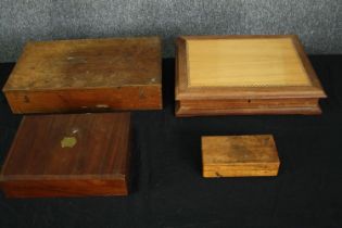 A group of four boxes, in various woods. H.7 W.35 D.27cm. (largest).