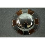 A mid 20th century shaped and partially coloured glass convex mirror, in the form of a flower