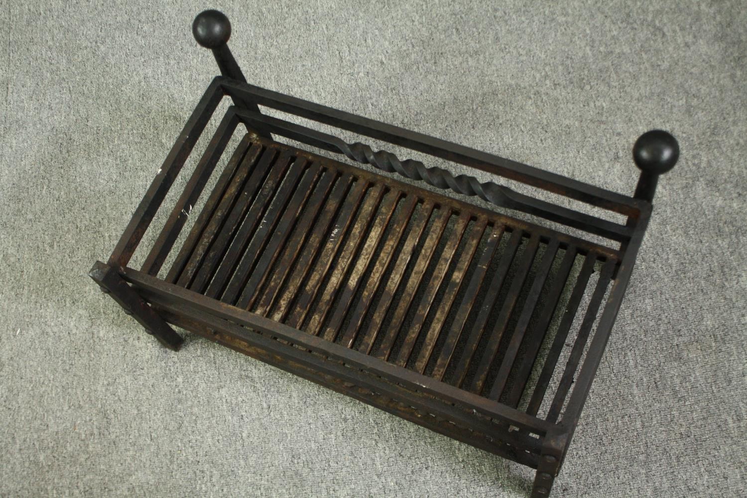 A cast iron fire grate. H.36 W.61 D.36cm. - Image 4 of 5