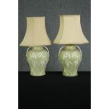 A pair of celadon glazed baluster table lamps, with bamboo decoration. H.49cm. (largest).