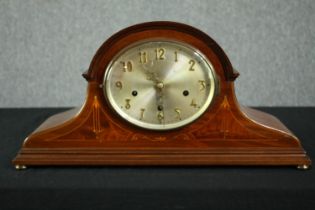 A mahogany and string inlaid mantel clock. H.28 W.55 D.17cm.