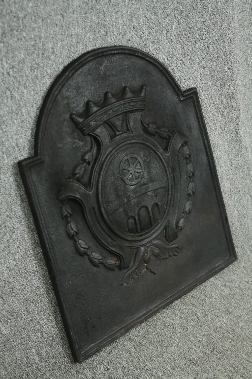 A cast iron fireback, possibly late 18th century. H.67 W.54cm. - Image 2 of 4