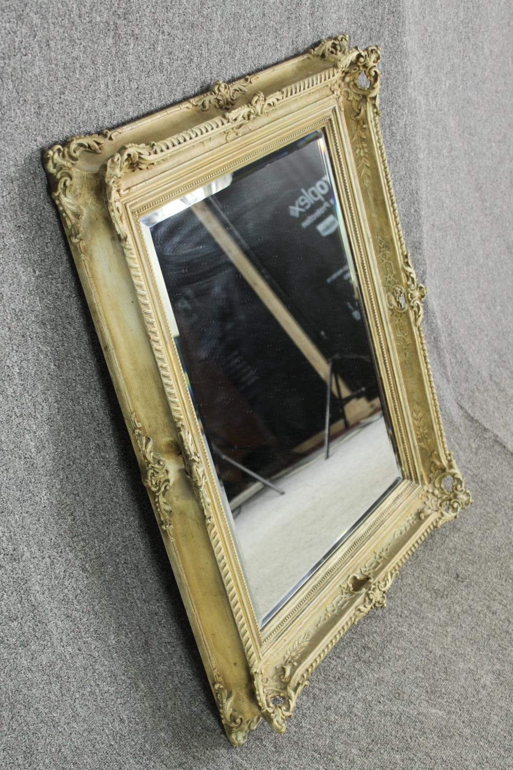 A cream painted carved wood and gesso wall mirror. H.96 W.77cm. - Image 2 of 5