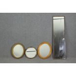 A group of four mirrors. H.120 W.32cm. (largest).