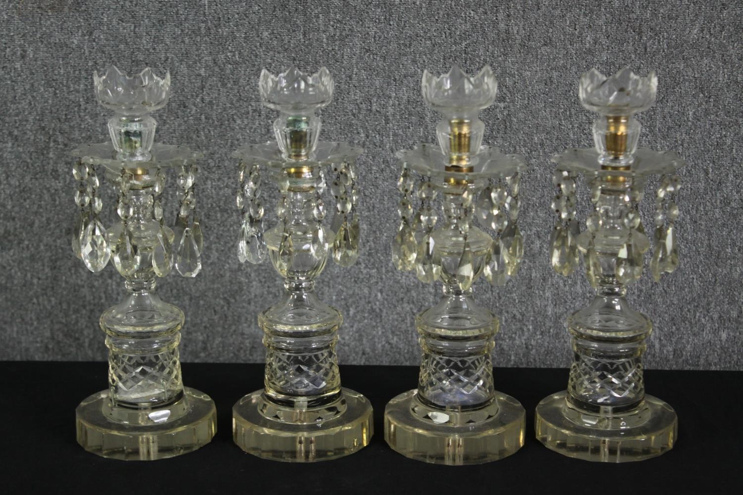A set of four cut glass lustres, 19th century. H.39cm. (each).
