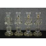 A set of four cut glass lustres, 19th century. H.39cm. (each).