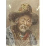 A pastel portrait of a Tibetan man, indistinctly signed, in a giltwood and glazed frame. H.45 W.