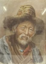 A pastel portrait of a Tibetan man, indistinctly signed, in a giltwood and glazed frame. H.45 W.