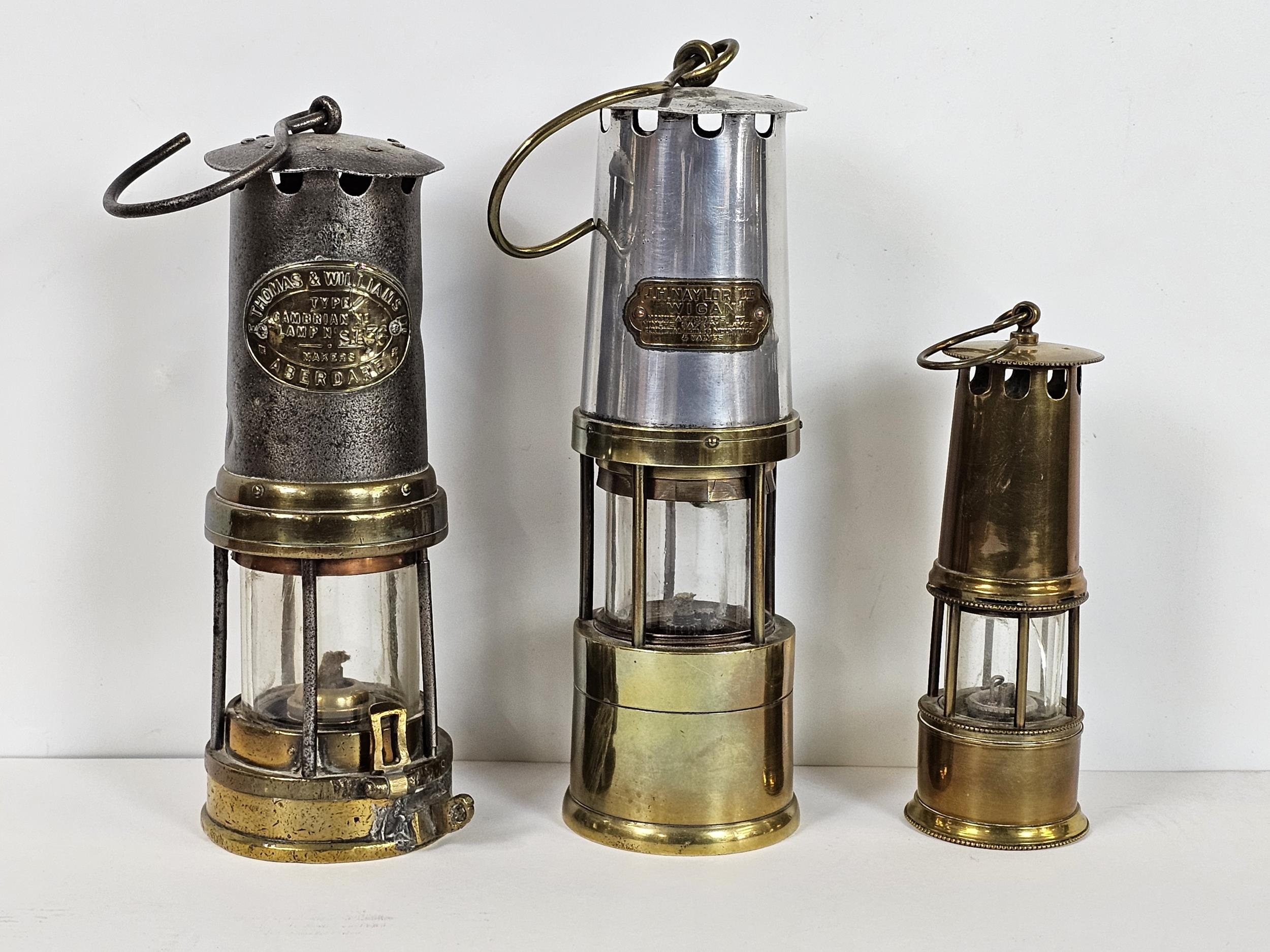 Three miner's lamps, including a Thomas and Williams, J H Naylor of Wigan, and another. Largest is - Image 2 of 15