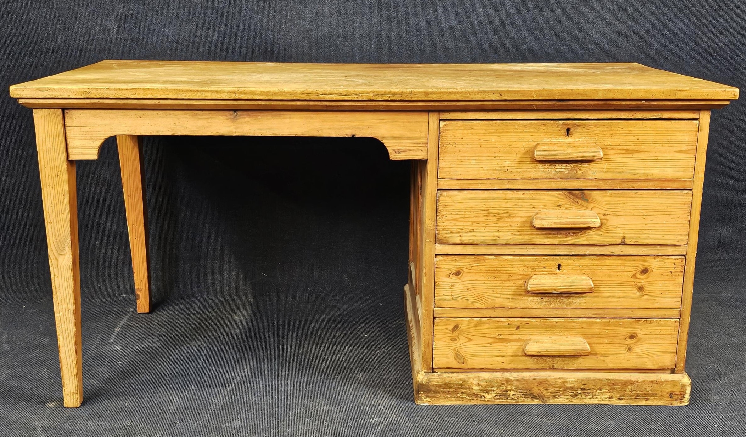 A pine desk, circa 1940. H. 75 W.153 D.75cm.