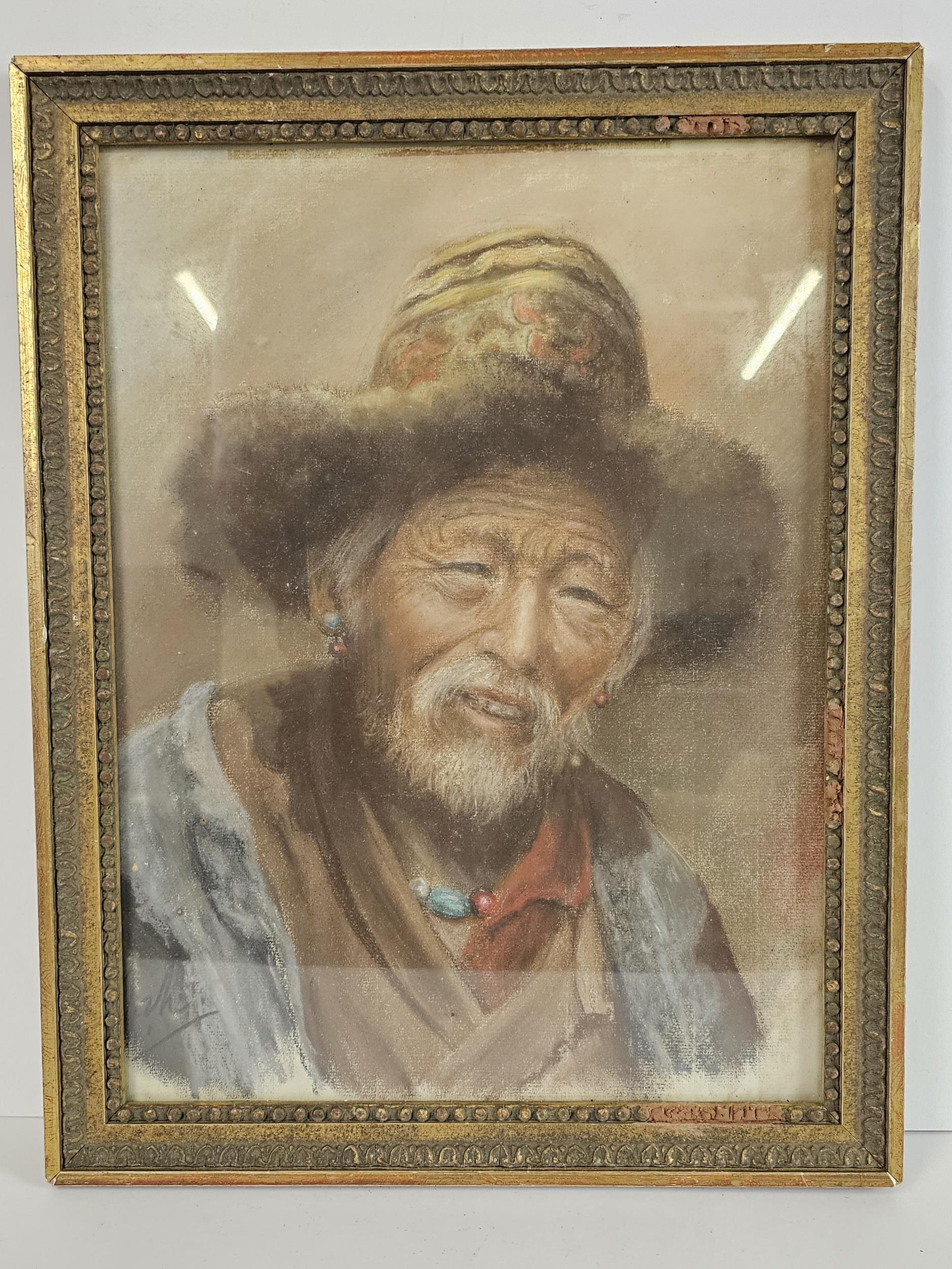 A pastel portrait of a Tibetan man, indistinctly signed, in a giltwood and glazed frame. H.45 W. - Image 2 of 5