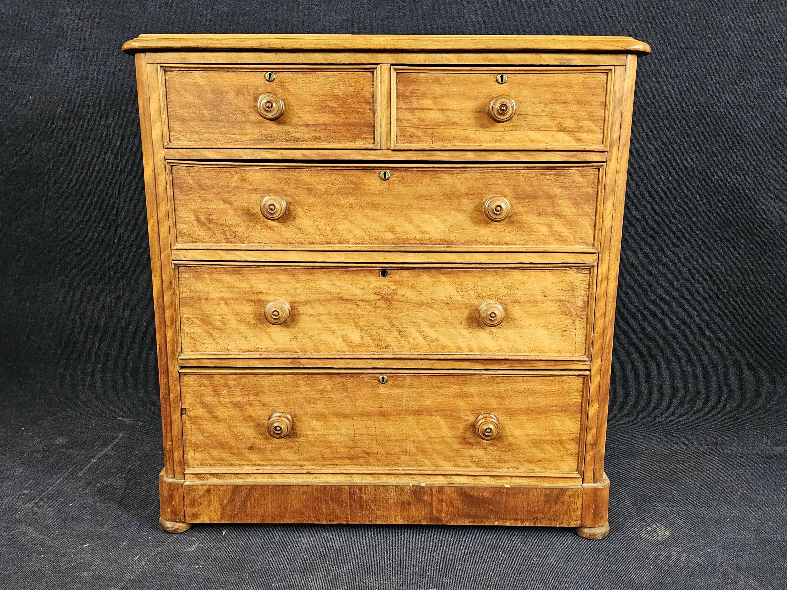 A Victorian satinwood chest of drawers. H.112 W.108 D.51cm.