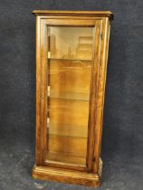 A walnut and glazed display cabinet, 20th century. H. 154 W.66 D.36cm.