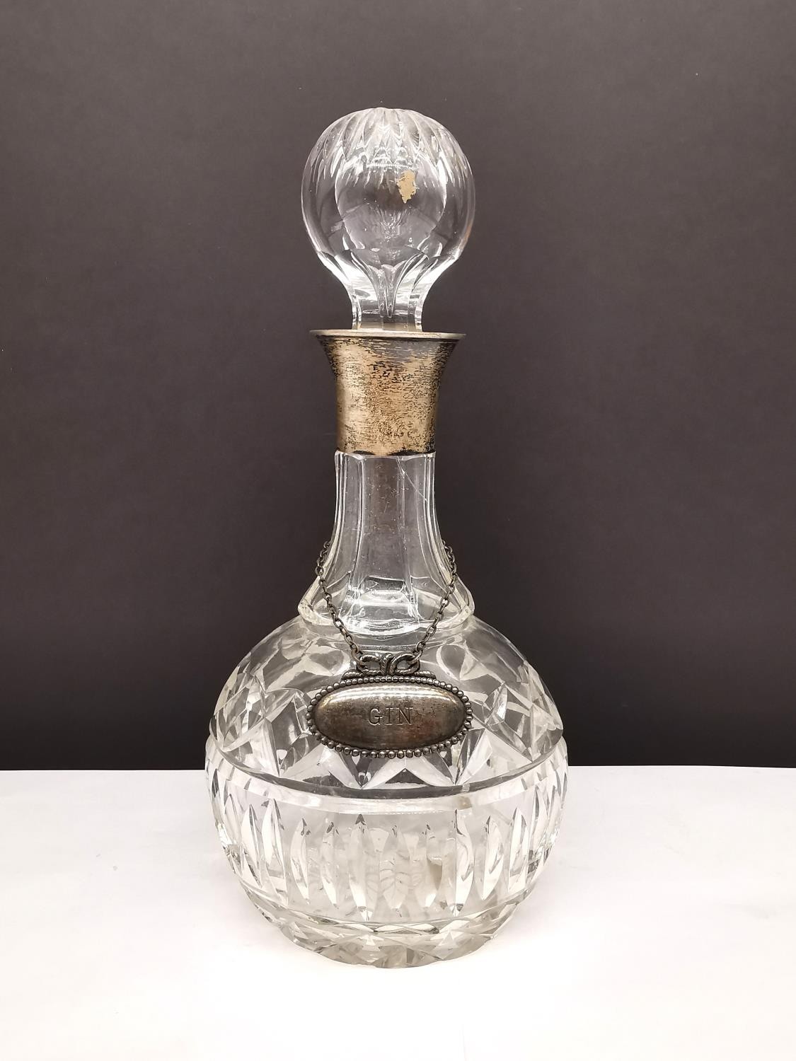 A Mappin & Webb cut crystal decanter with silver collar and EPNS 'Gin' label. (hair line crack to