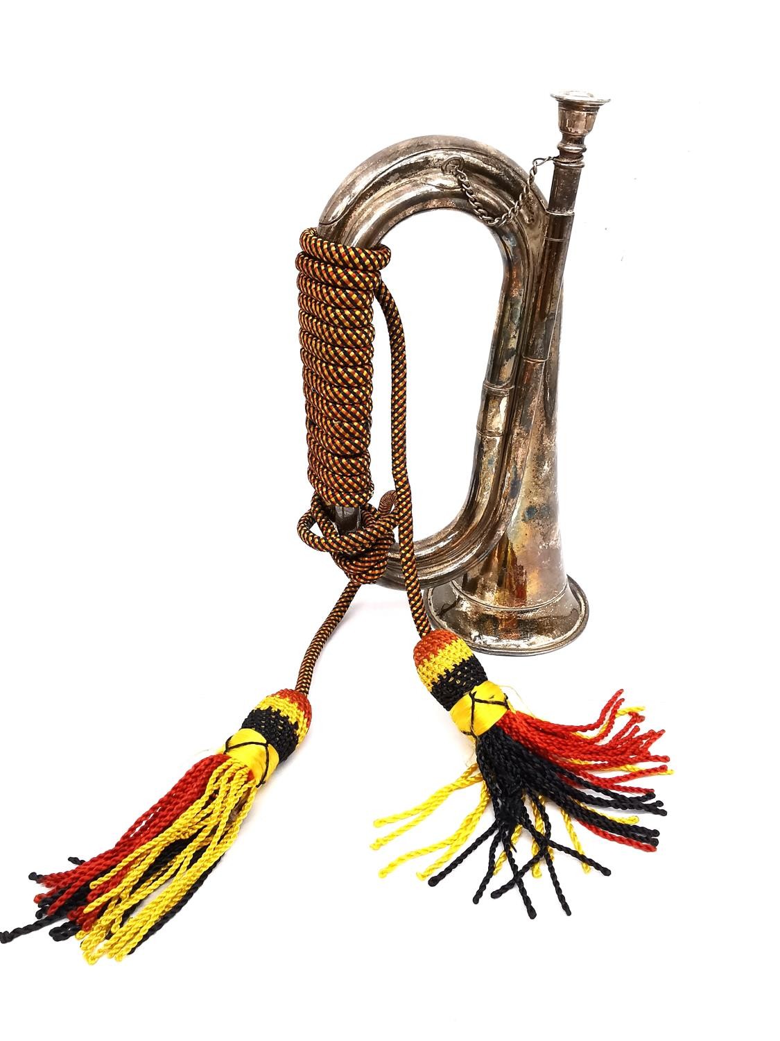 A silver plated bugle with red black and yellow silk rope with tassel ends. L.28 W.19cm - Image 2 of 4