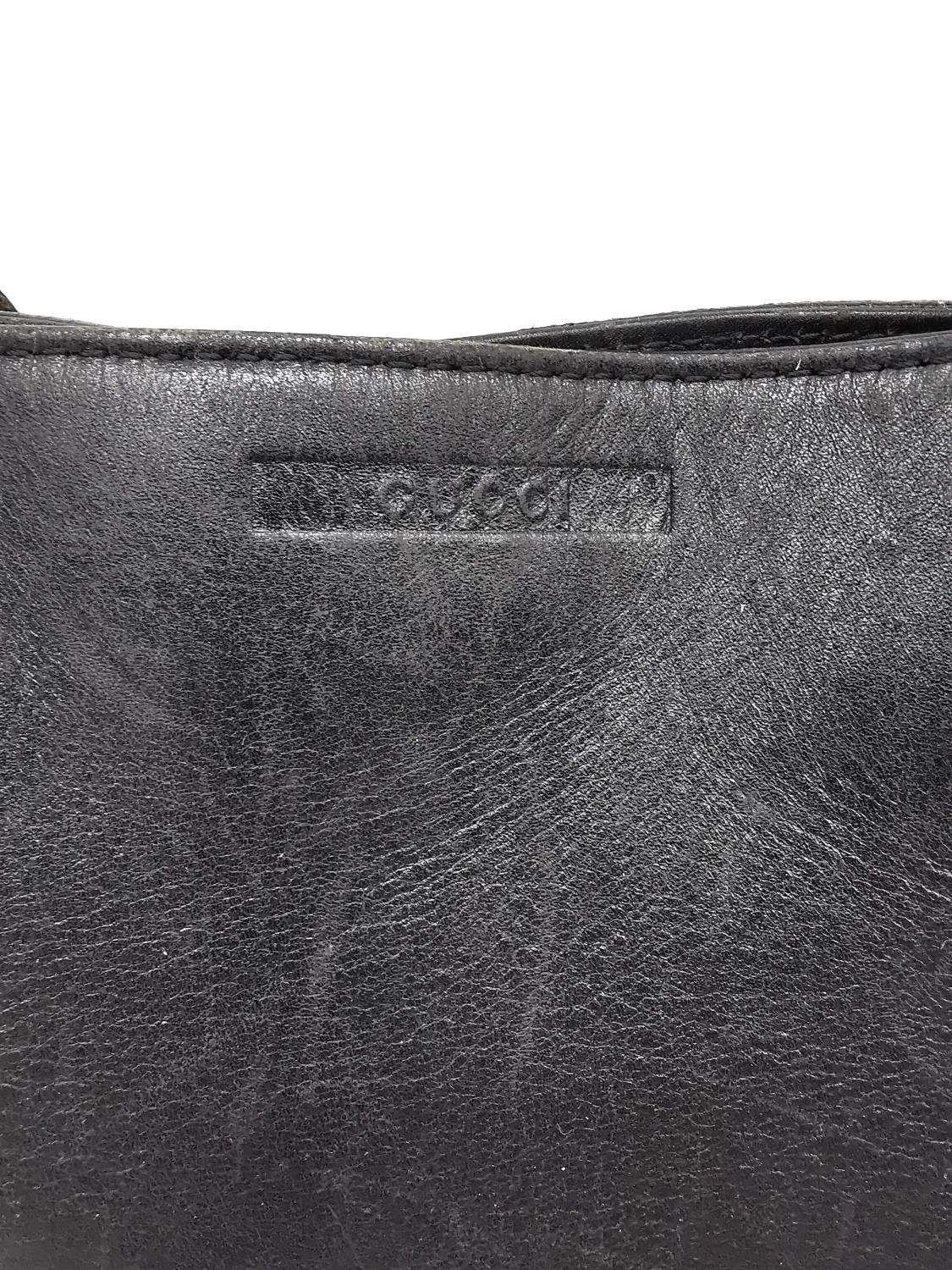 A Gucci Black web leather tote handbag with brown and beige strap. Magnetic snap closure and - Image 3 of 9