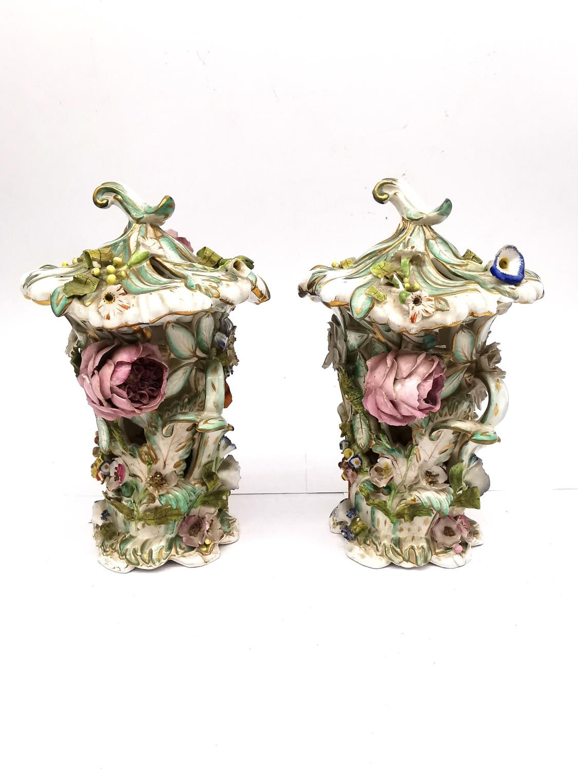 A pair of mid 19th century Bloor Derby floral encrusted hand painted porcelain Potpourri lidded