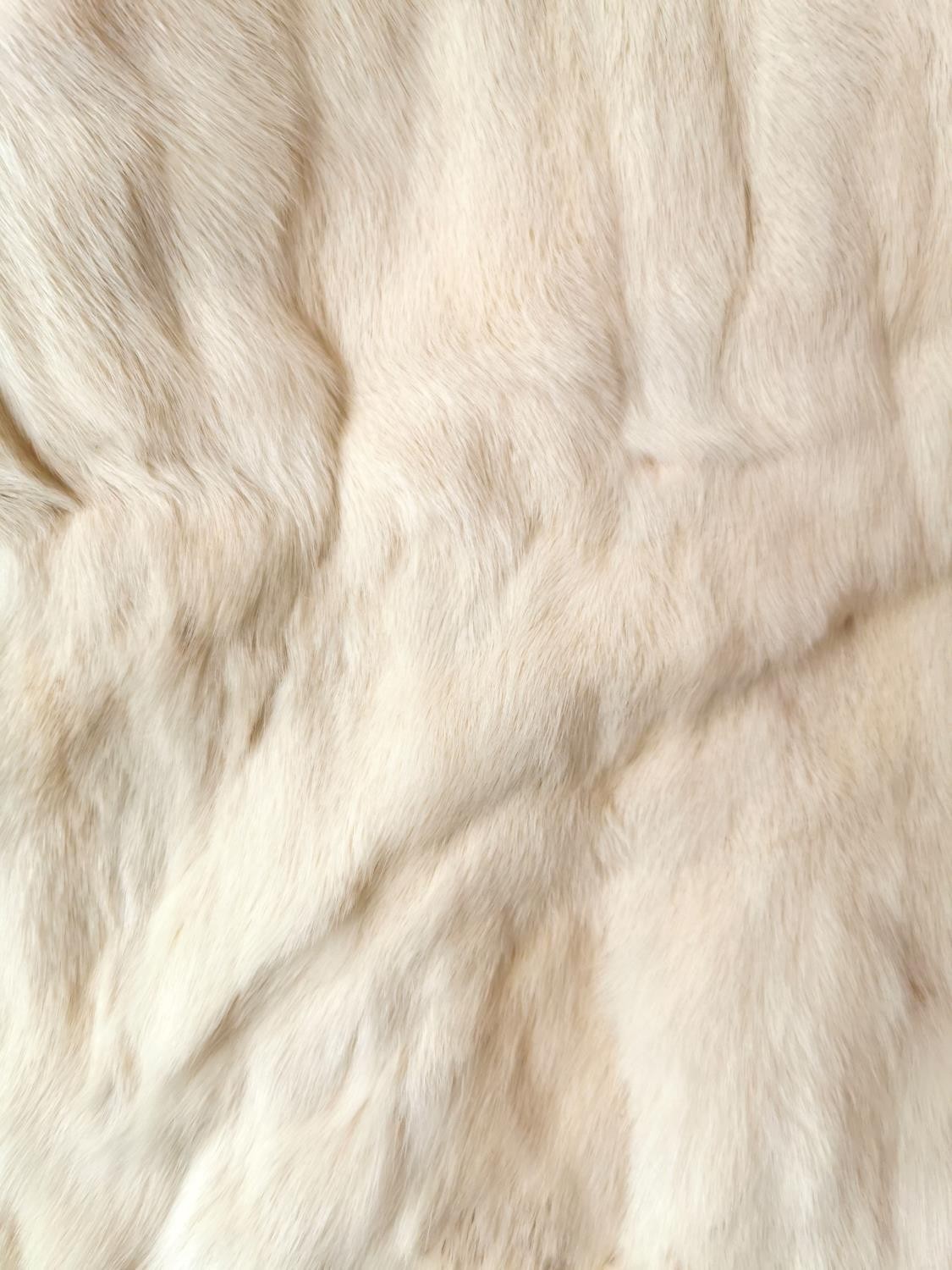 A vintage white mink fur sole with front pockets, with designer label 'National Fur Co Ltd. and - Image 3 of 9
