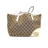 A Gucci GG canvas brtitt large tote bag beige and ebony, red, green and white striped interior. Base