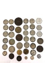A collection of tokens and coins to include un franc and 50 cents, dated 1896, an attractive 1812